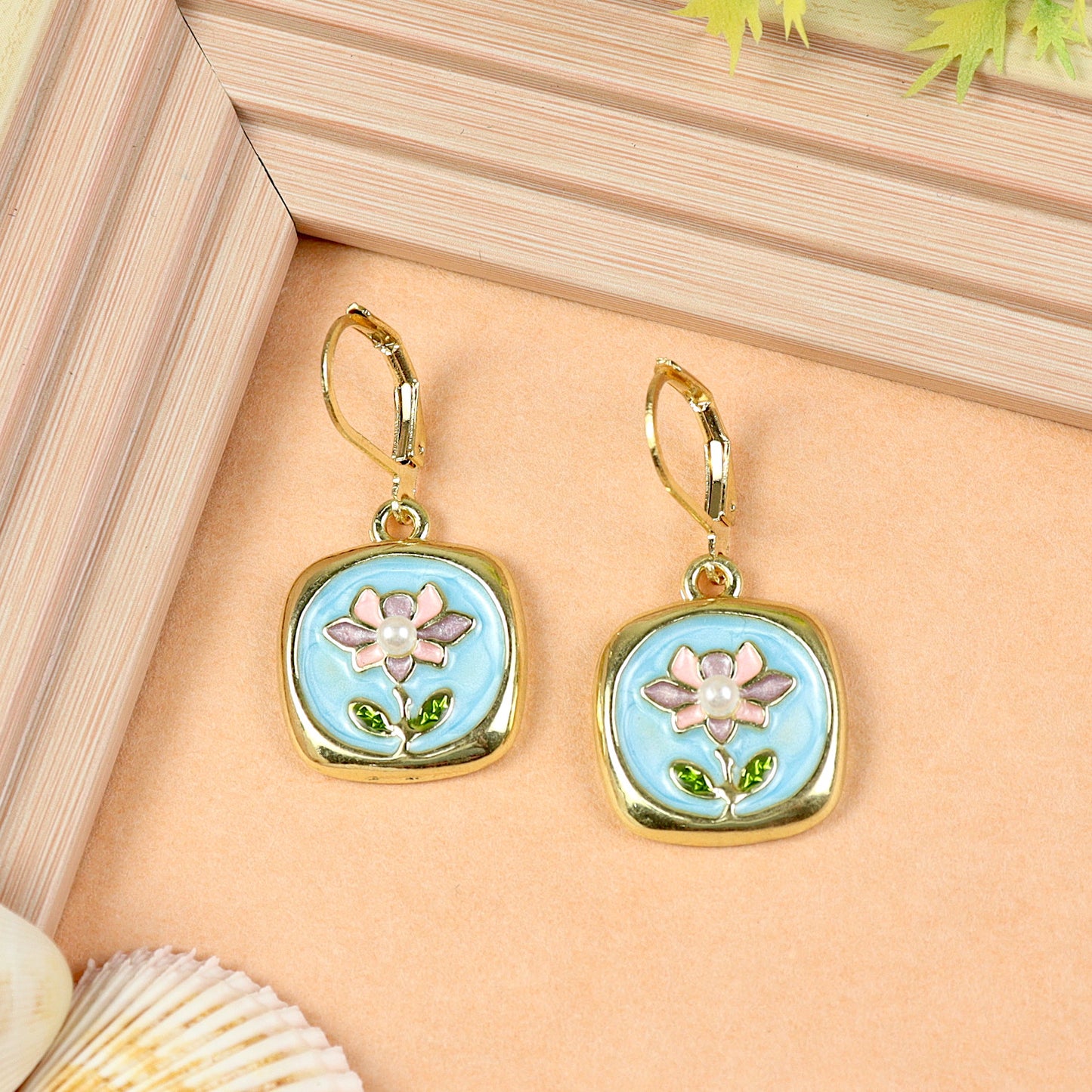 Floral Charm earrings for girls in metal charms, laid flat