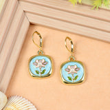 Floral Charm earrings for girls in metal charms, laid flat