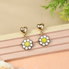Smiley Charm earrings for girls in metal charms, laid flat