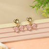 Bow Charm earrings for girls in metal charms, laid flat