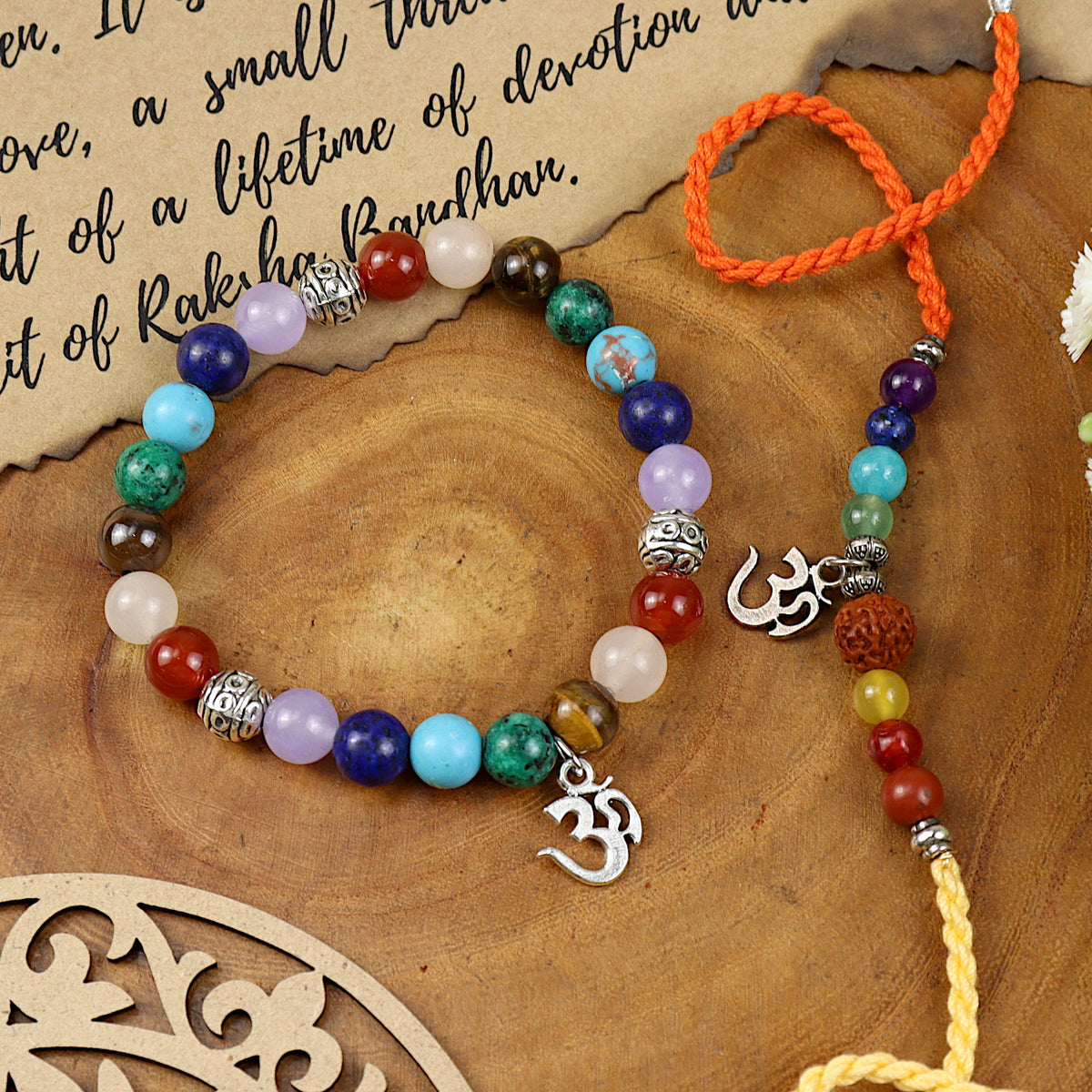 Seven Chakra Om bracelet and Rakhi laid flat — Bhai Bhabhi Rakhi set