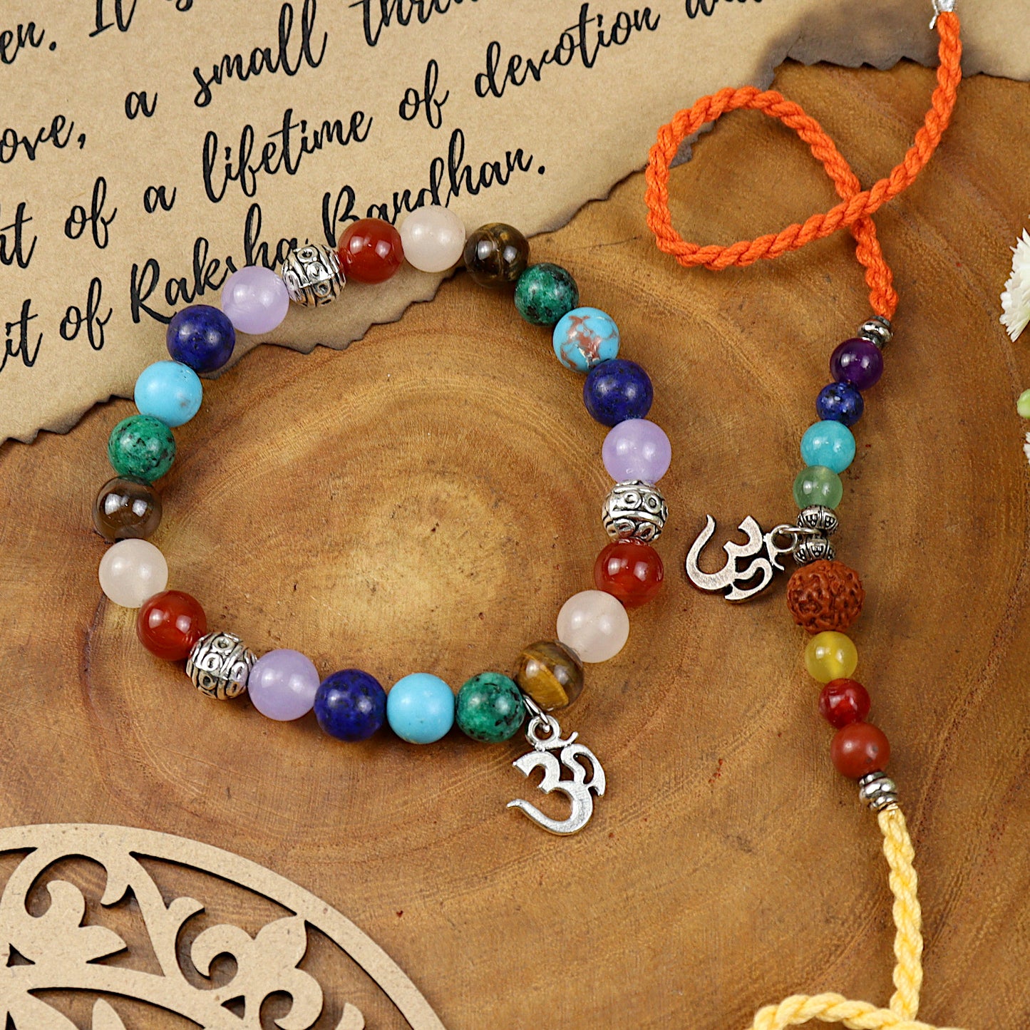 Seven Chakra Om bracelet and Rakhi laid flat — Bhai Bhabhi Rakhi set