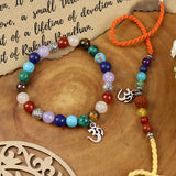 Seven Chakra Om bracelet and Rakhi laid flat — Bhai Bhabhi Rakhi set