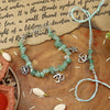 Aventurine Om bracelet and Rakhi laid flat — Bhai Bhabhi Rakhi set