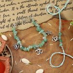Aventurine Om bracelet and Rakhi laid flat — Bhai Bhabhi Rakhi set