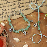 Aventurine Om bracelet and Rakhi laid flat — Bhai Bhabhi Rakhi set