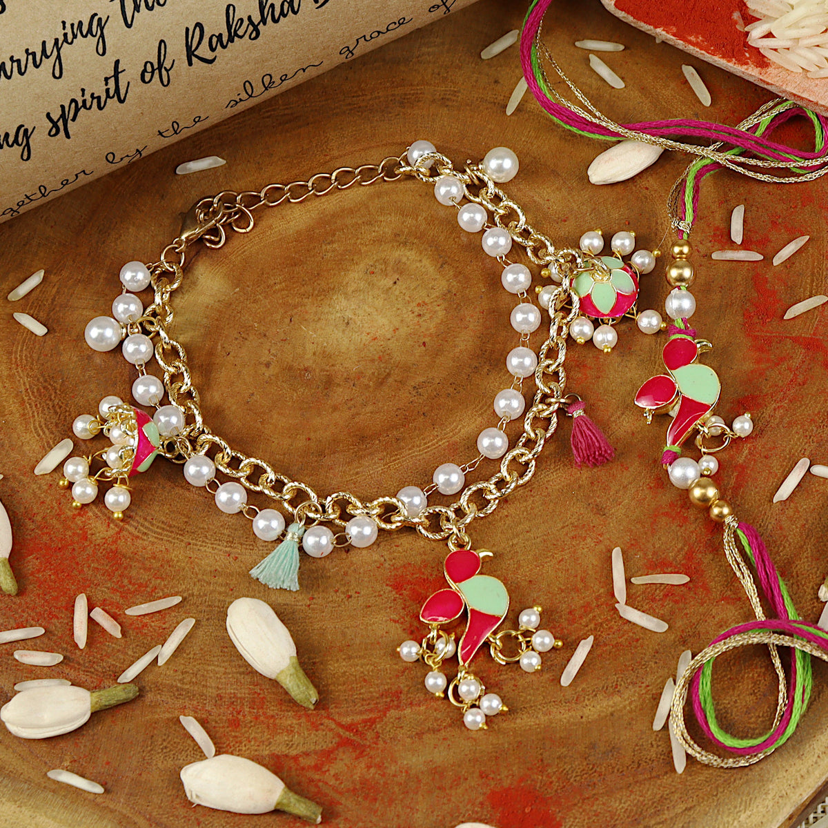 Parrot Jhumki bracelet and Rakhi laid flat — Bhai Bhabhi Rakhi set