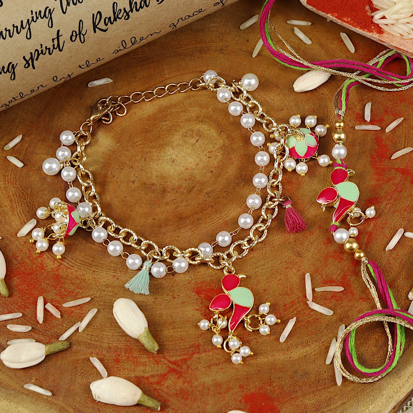 Parrot Jhumki bracelet and Rakhi laid flat — Bhai Bhabhi Rakhi set