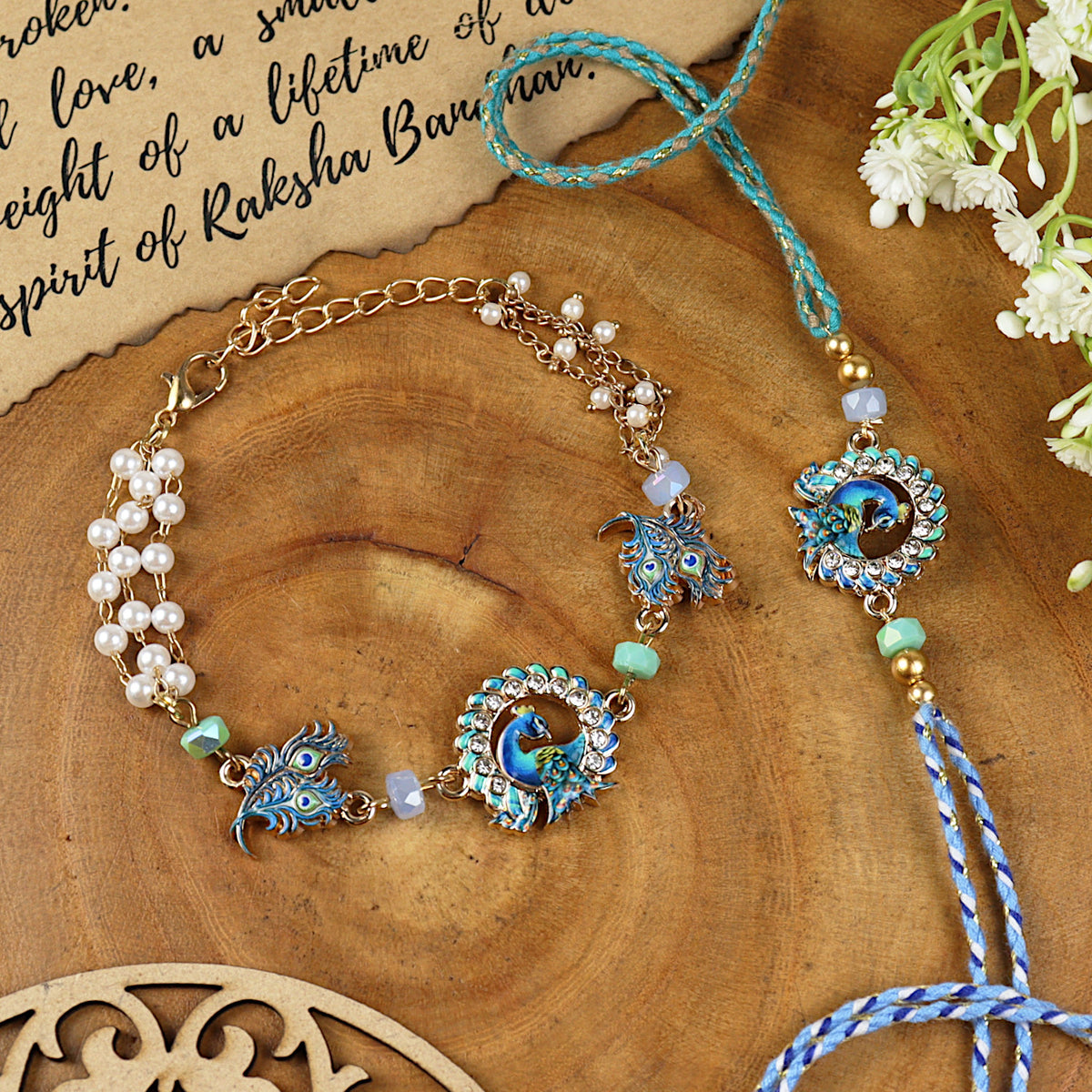 Peacock bracelet and Rakhi laid flat — Bhai Bhabhi Rakhi set