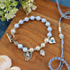 Hamsa Evil Eye Charm bracelet and Rakhi laid flat — Bhai Bhabhi Rakhi set