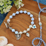 Hamsa Evil Eye Charm bracelet and Rakhi laid flat — Bhai Bhabhi Rakhi set
