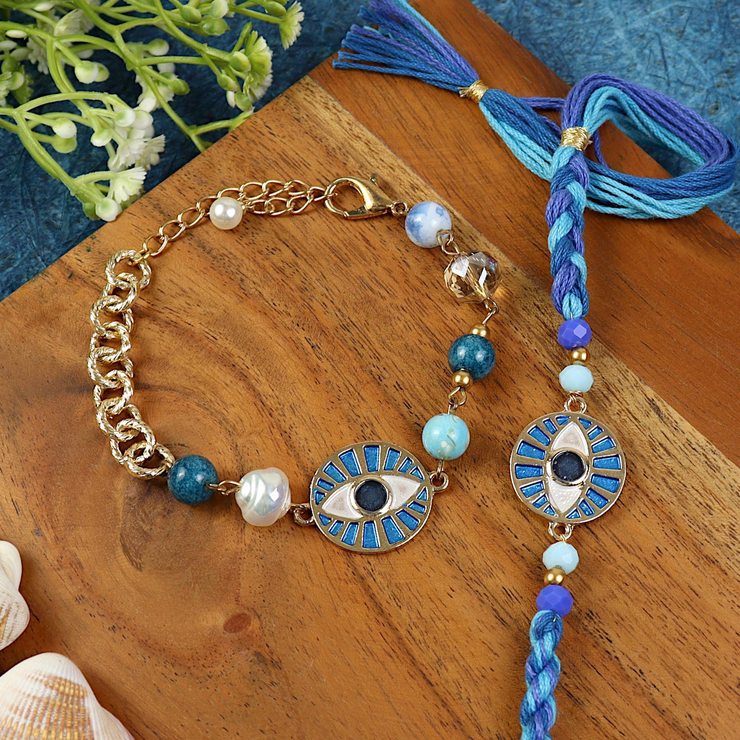 Evil Eye Charm bracelet and Rakhi laid flat — Bhai Bhabhi Rakhi set