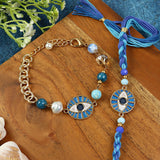 Evil Eye Charm bracelet and Rakhi laid flat — Bhai Bhabhi Rakhi set