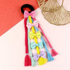Bow tassel fabric hair tie, laid flat