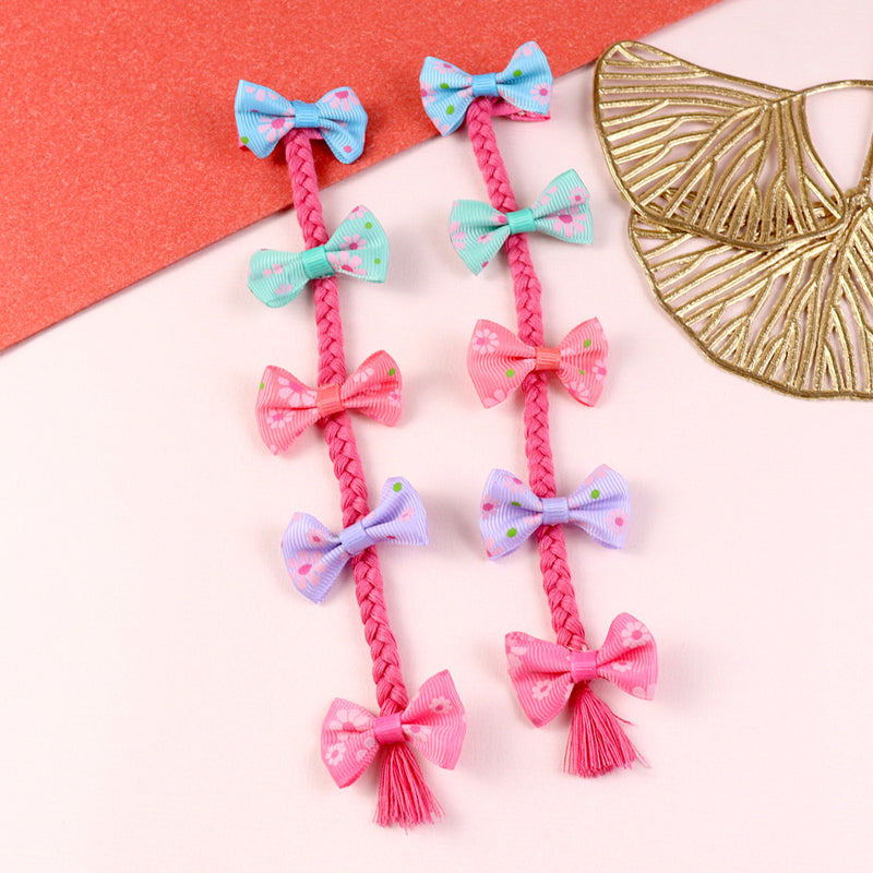 Pair of bow tassel fabric hair clips, laid flat