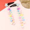 Resin charm beaded tassel hair clip duo, laid flat