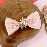 Fabric bow charm hair clip, laid flat