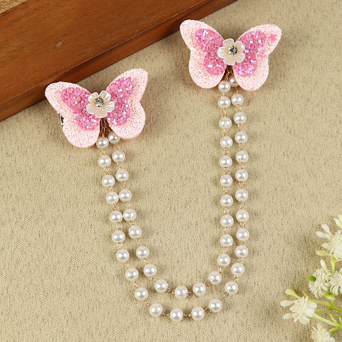 Pink Butterfly Glitter Hair Clip, laid flat