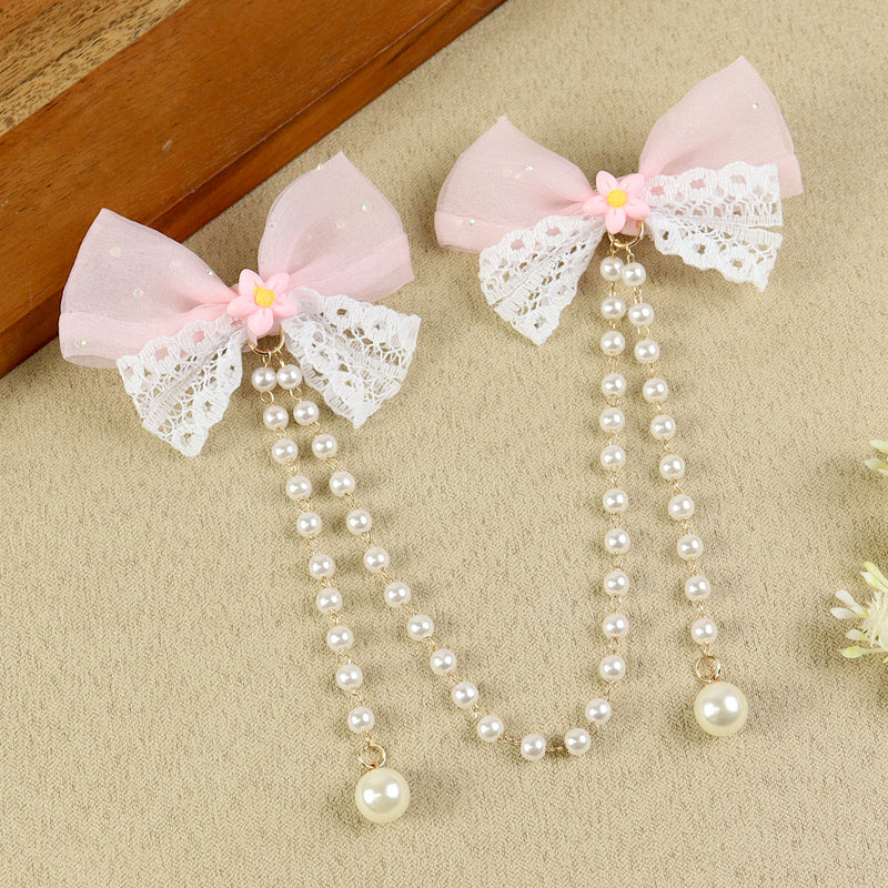 Pink Bow Tassels Hair Clip, laid flat