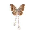 Gold Butterfly Beaded Tassel Hair Clip worn in hair, showing the beaded butterfly and its tassel drop