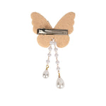 Close-up of the beaded butterfly and its tassel drop on the gold clip