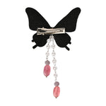 Close-up of the beaded butterfly and its tassel drop on the purple clip