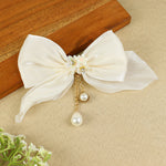 White Bow Tassels Hair Clip, laid flat