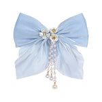 Blue Bow Tassels Hair Clip worn in hair, showing the tassel drop