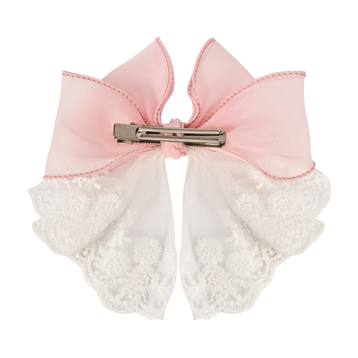 Close-up of the floral charm on the bow on the pink clip