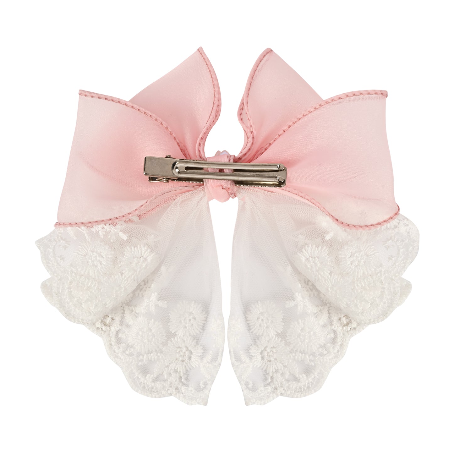 Close-up of the floral charm on the bow on the pink clip