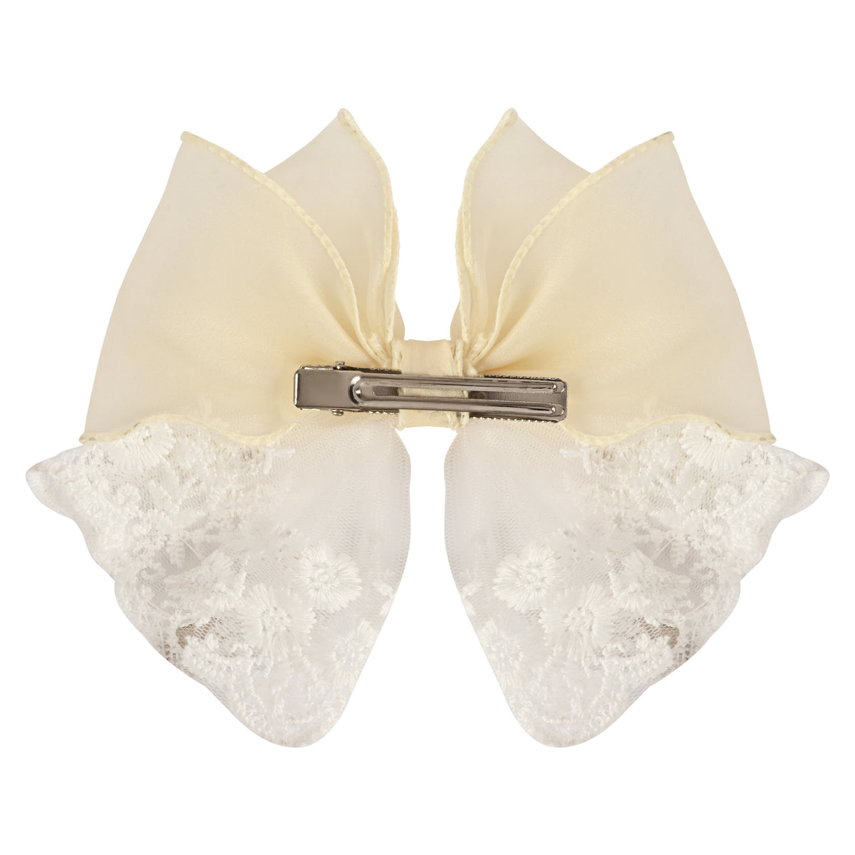 Close-up of the floral charm on the bow on the white clip