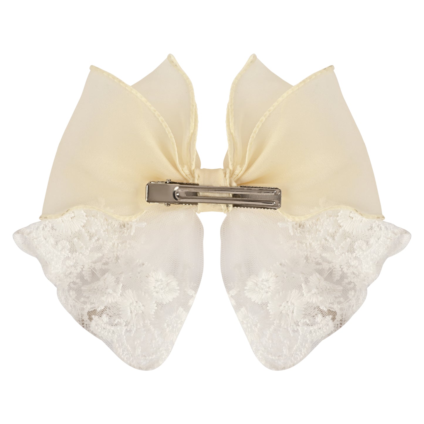 Close-up of the floral charm on the bow on the white clip