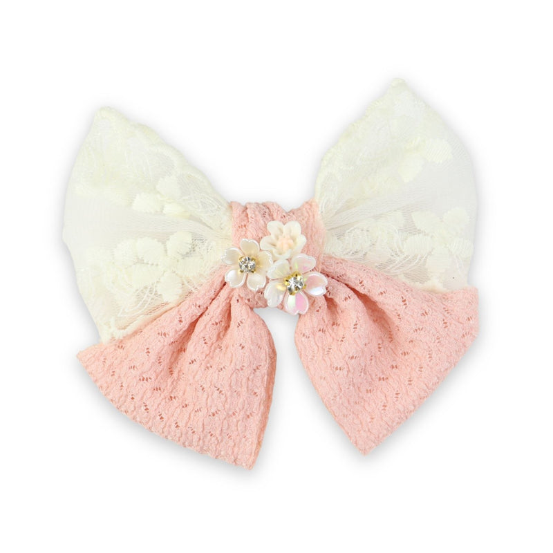 Pink Floral Charm Bow Hair Clip worn in hair, showing the floral charm on the bow
