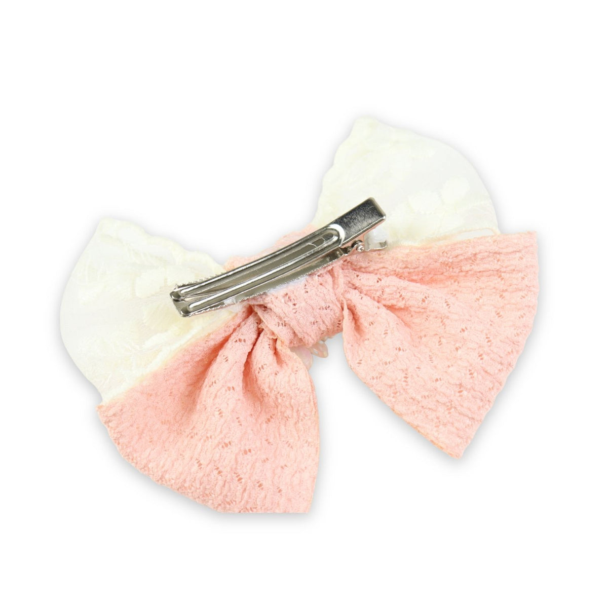 Close-up of the floral charm on the bow on the pink clip