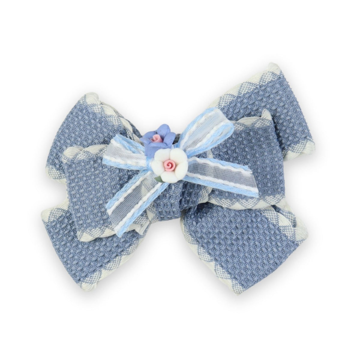Blue Floral Charm Bow Hair Clip worn in hair, showing the floral charm on the bow