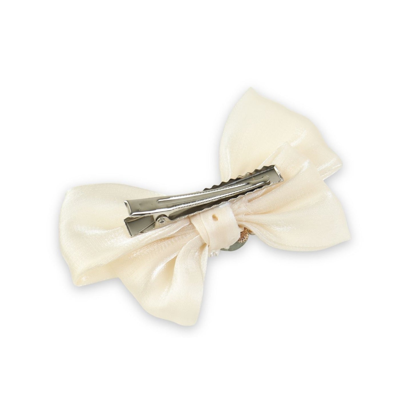 Close-up of the floral charm on the bow on the white clip