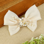 White Floral Charm Bow Hair Clip, laid flat
