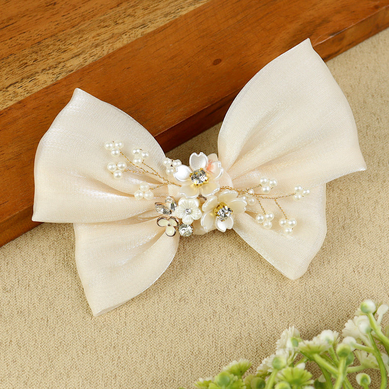 White Floral Charm Bow Hair Clip, laid flat