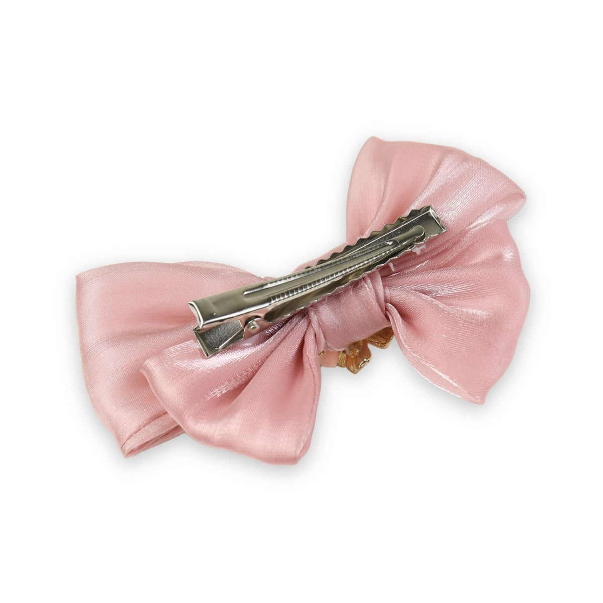Close-up of the floral charm on the bow on the pink clip