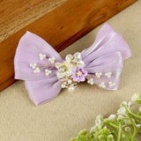 Purple Floral Charm Bow Hair Clip, laid flat