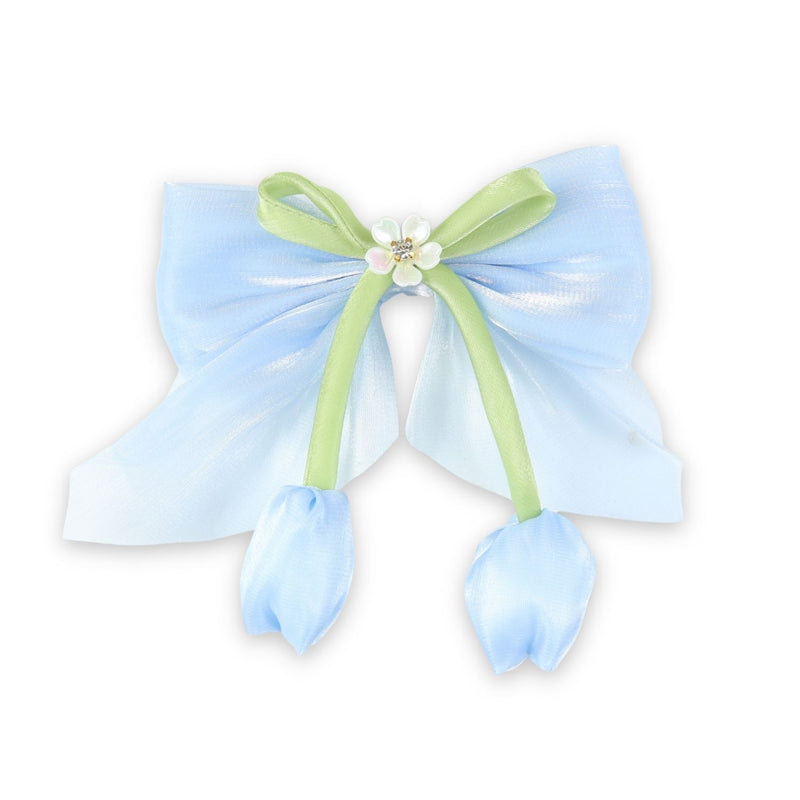 Blue Floral Charm Bow Hair Clip worn in hair, showing the floral charm on the bow
