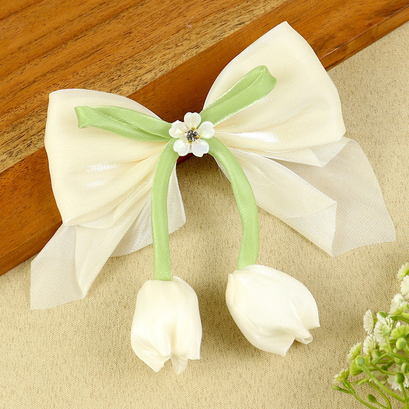 White Floral Charm Bow Hair Clip, laid flat