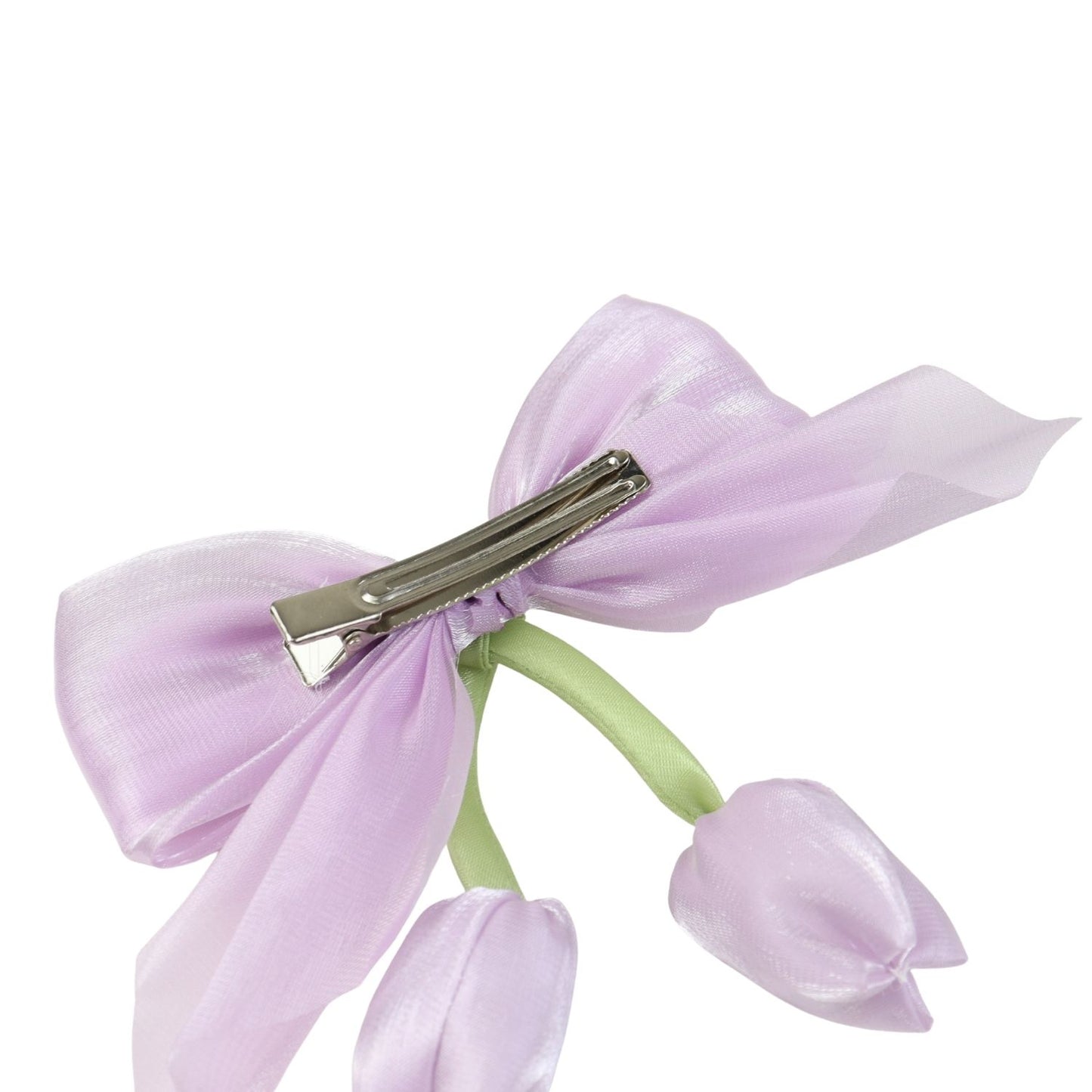 Close-up of the floral charm on the bow on the purple clip