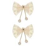 White Bow Tassels Hair Clips worn in hair, showing the tassel drop