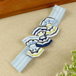 soft, stretchable elastic headband featuring pastel flowers.