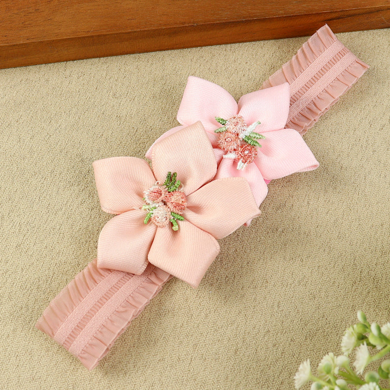 soft, stretchable elastic headband featuring pastel flowers.