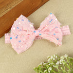soft, stretchable elastic headband featuring pastel flowers.
