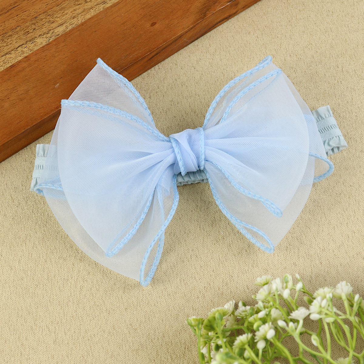 soft, stretchable elastic headband featuring pastel flowers.