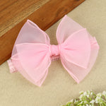 soft, stretchable elastic headband featuring pastel flowers.