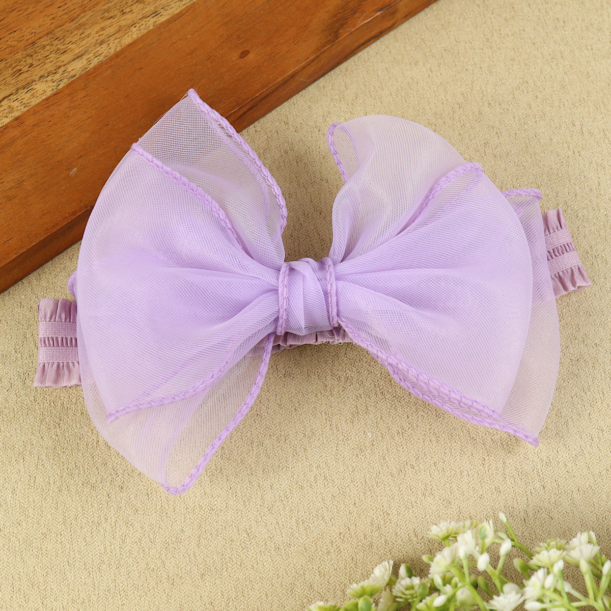 soft, stretchable elastic headband featuring pastel flowers.